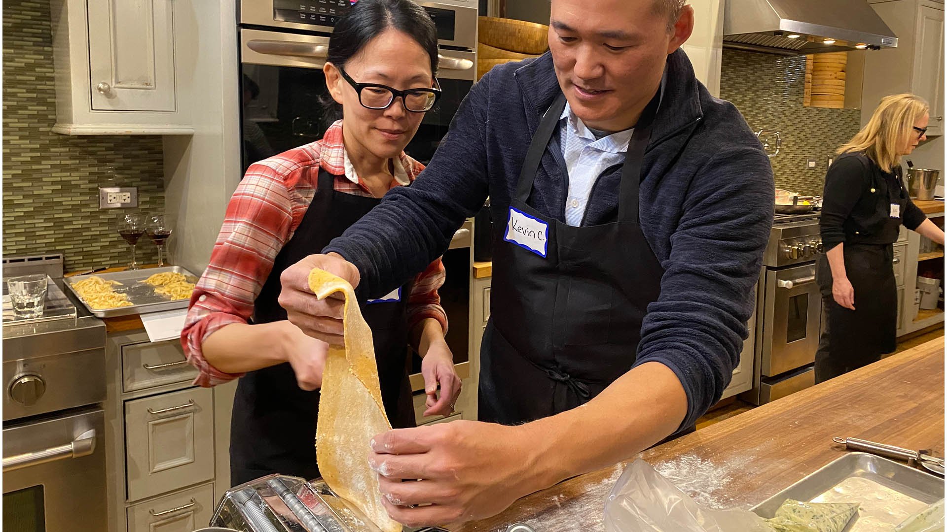 16x9 Students Rolling Pasta Dough