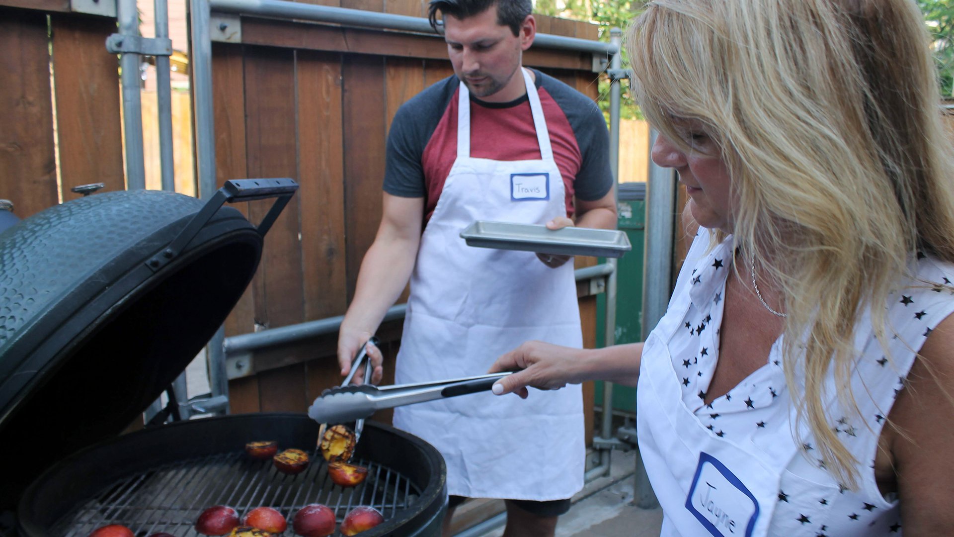 16x9-Couple-Grilling-Peaches