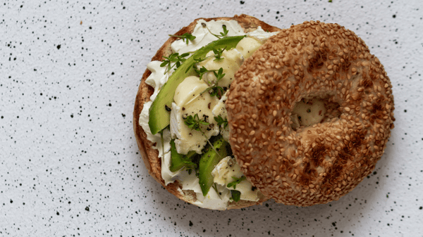 Bagel with cream cheese and avocado