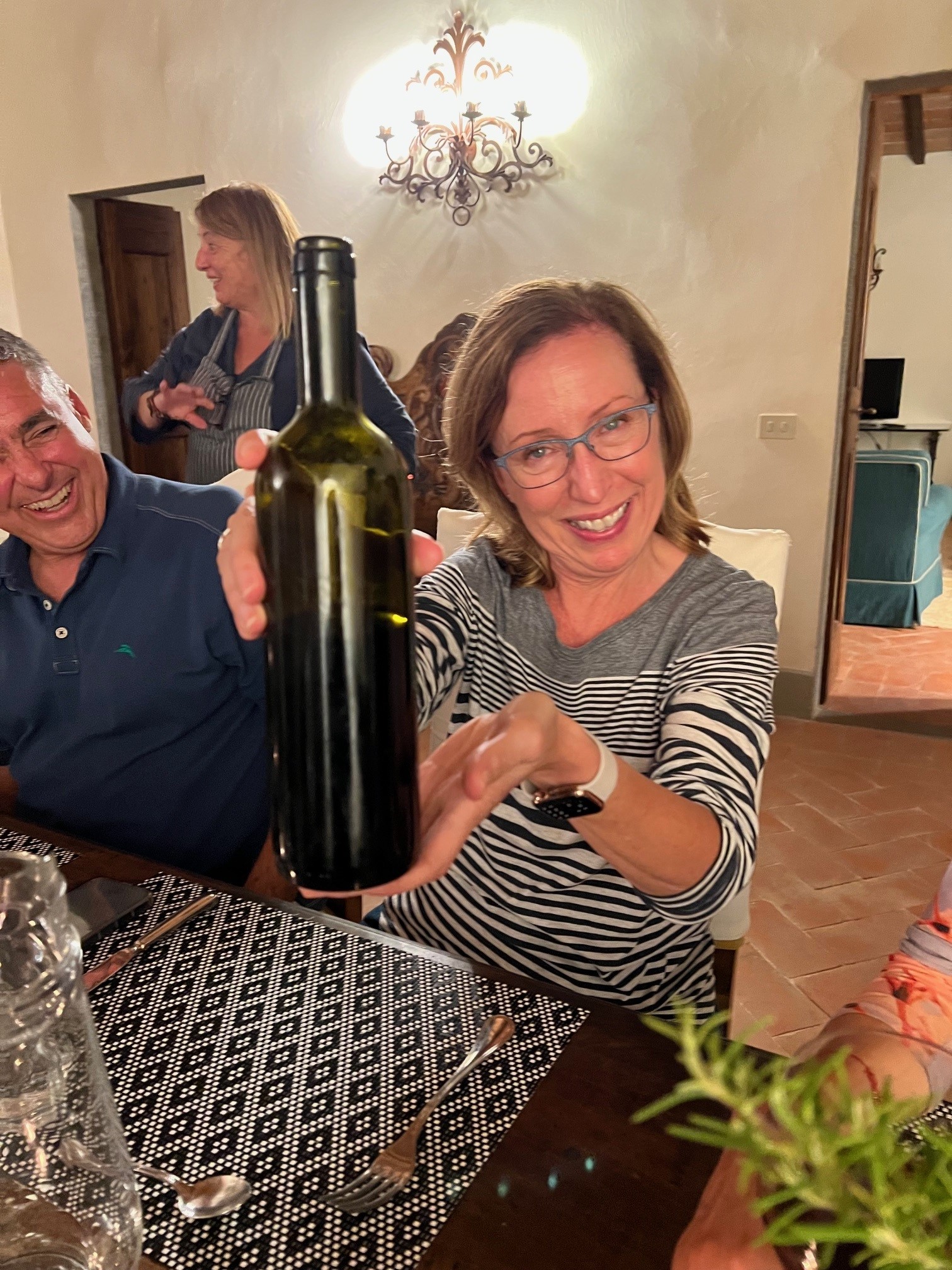 Lisa with unmarked bottle of wine