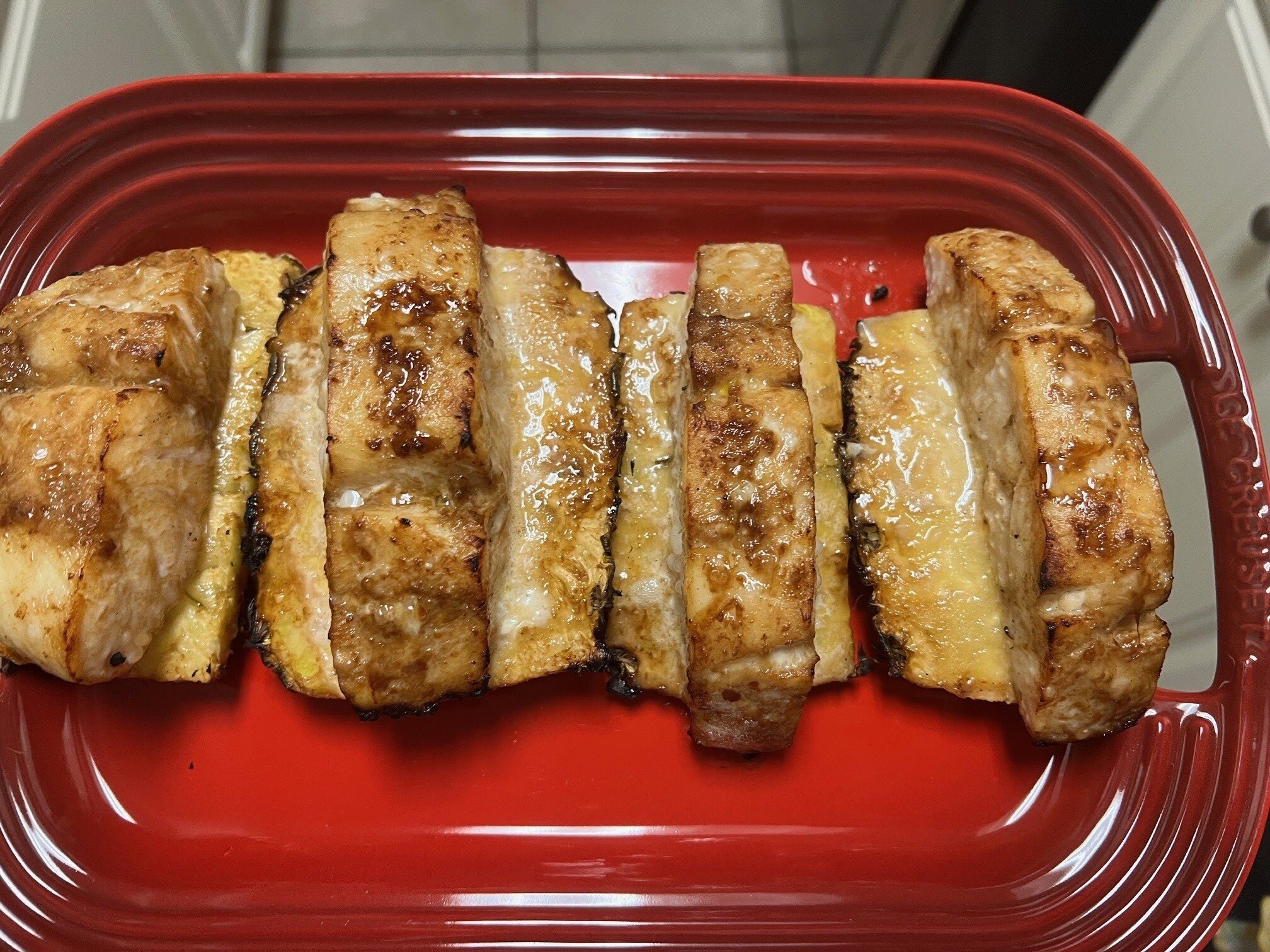 Plated fish on planks