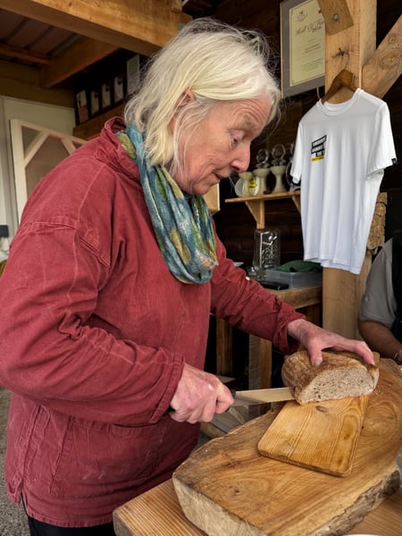 Sally cuts bread
