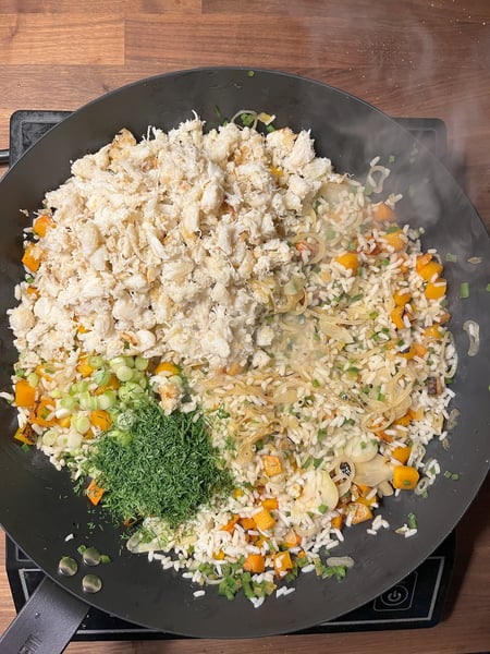 Add back crab and herbs