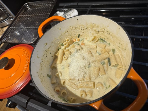 Soup in pot with pasta and cheese