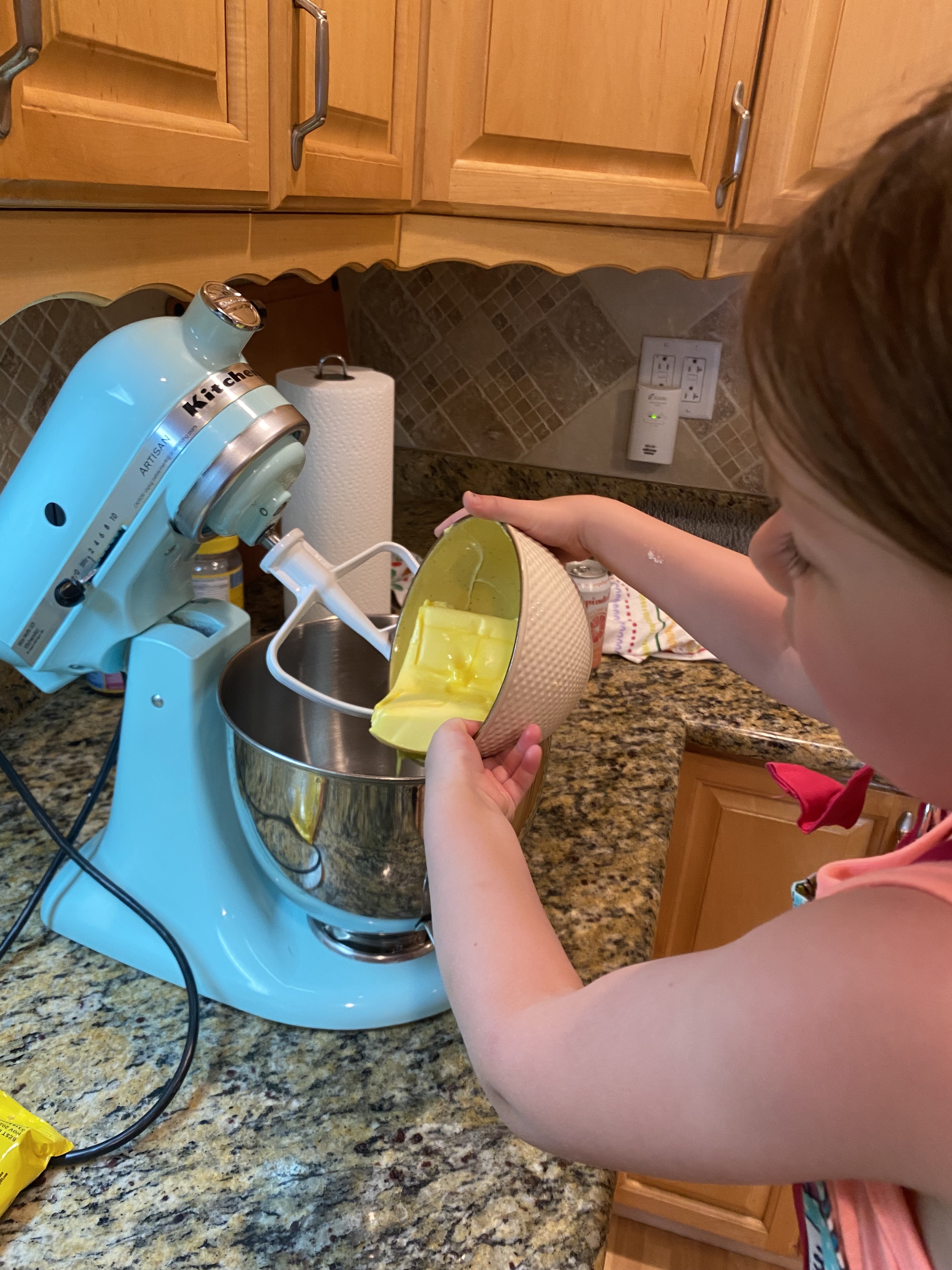Kid using stand mixer