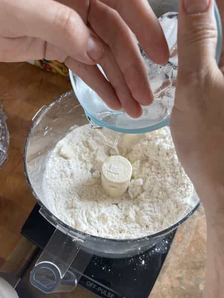 Adding water to pie dough