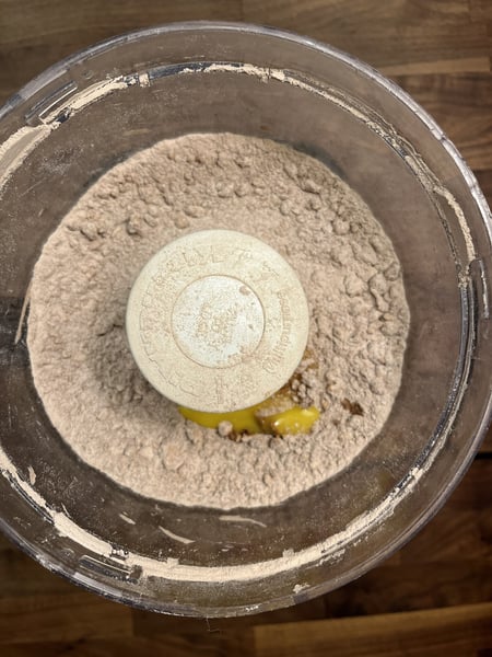 Add egg to dry