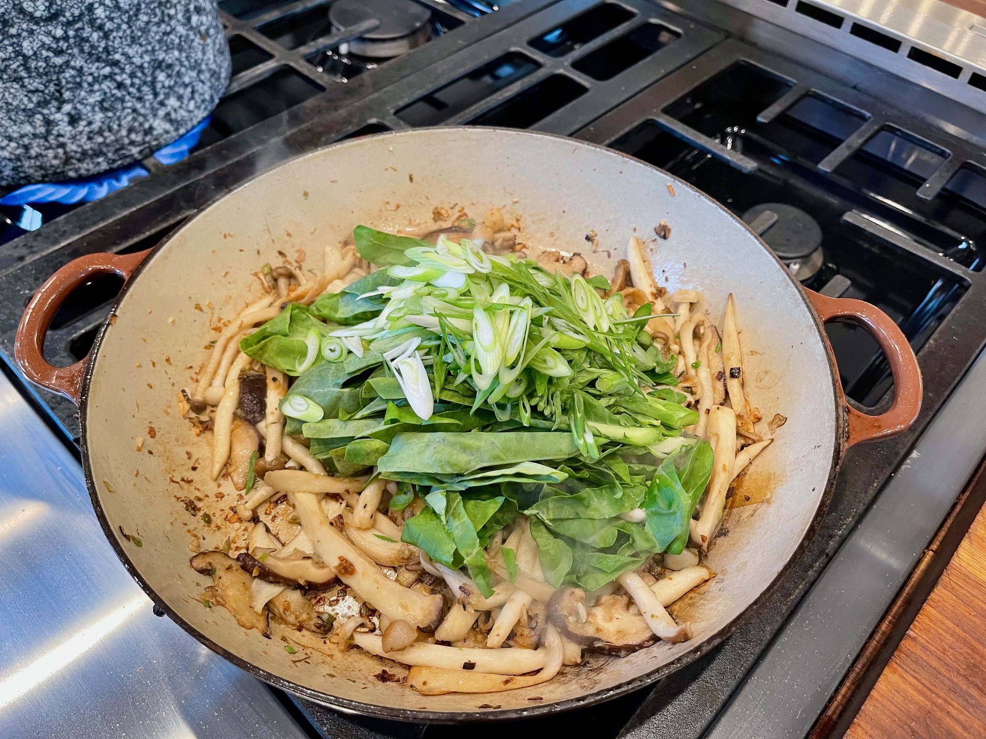 Adding broccoli and scallions