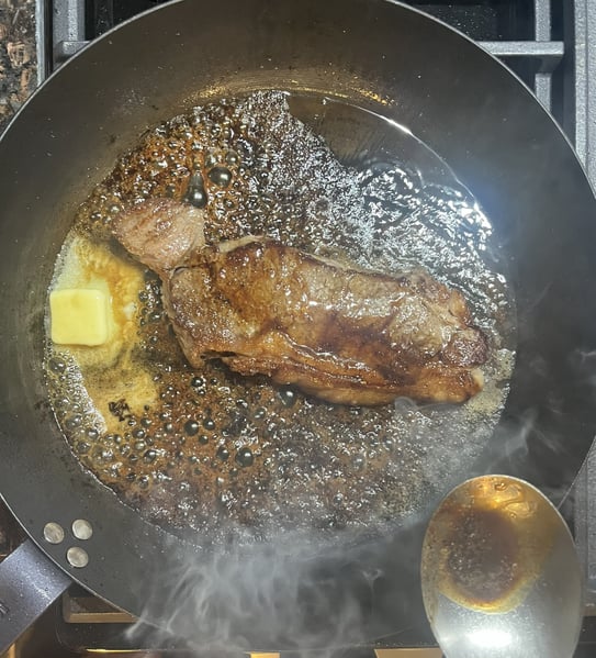 Basting steak