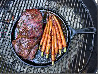 beef with carrots on grill overhead
