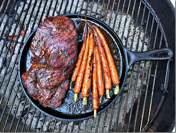 beef with carrots on grill overhead