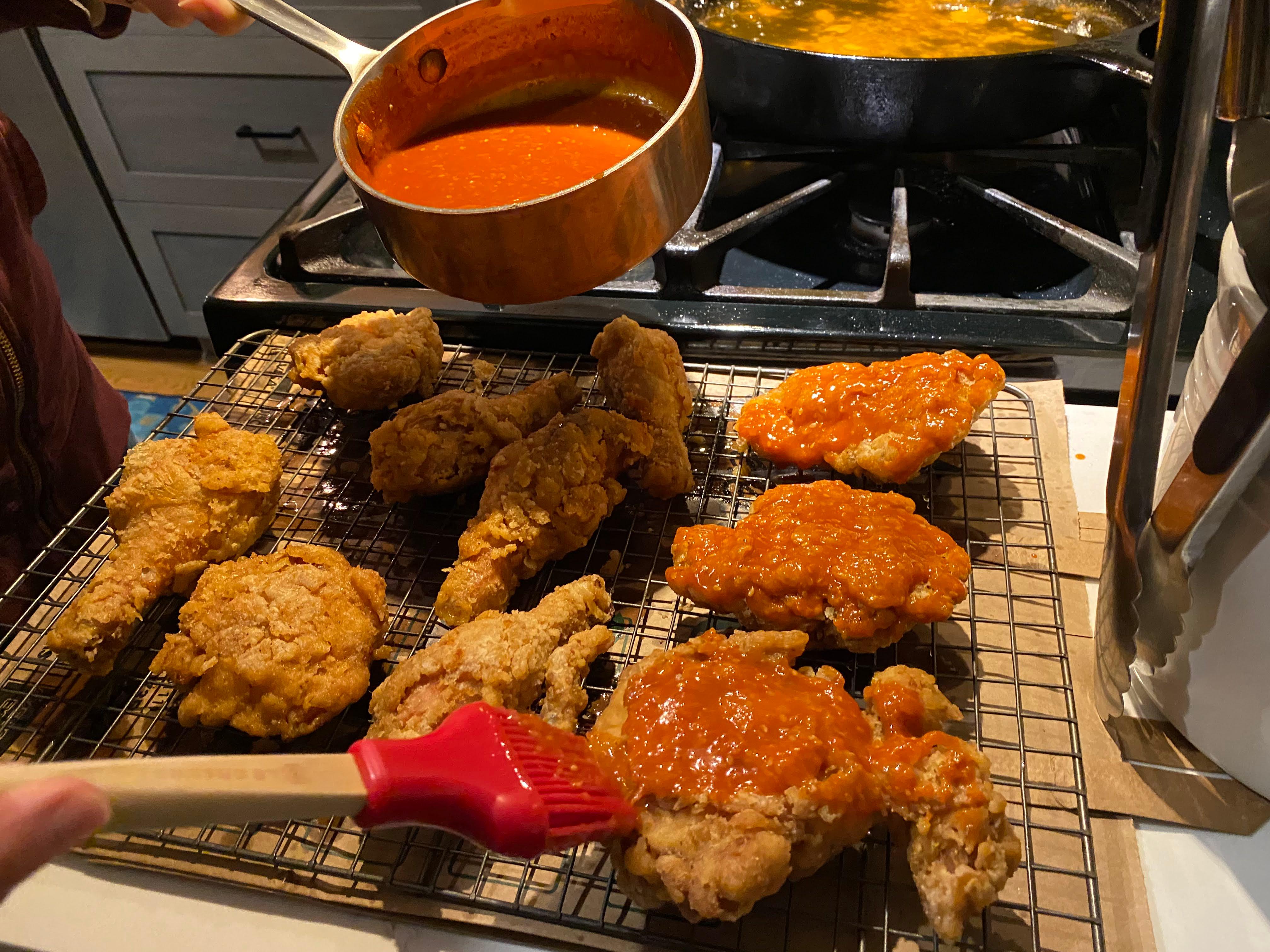 Brushing chicken with sauce