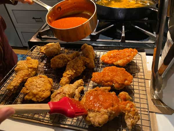 Brushing chicken with sauce