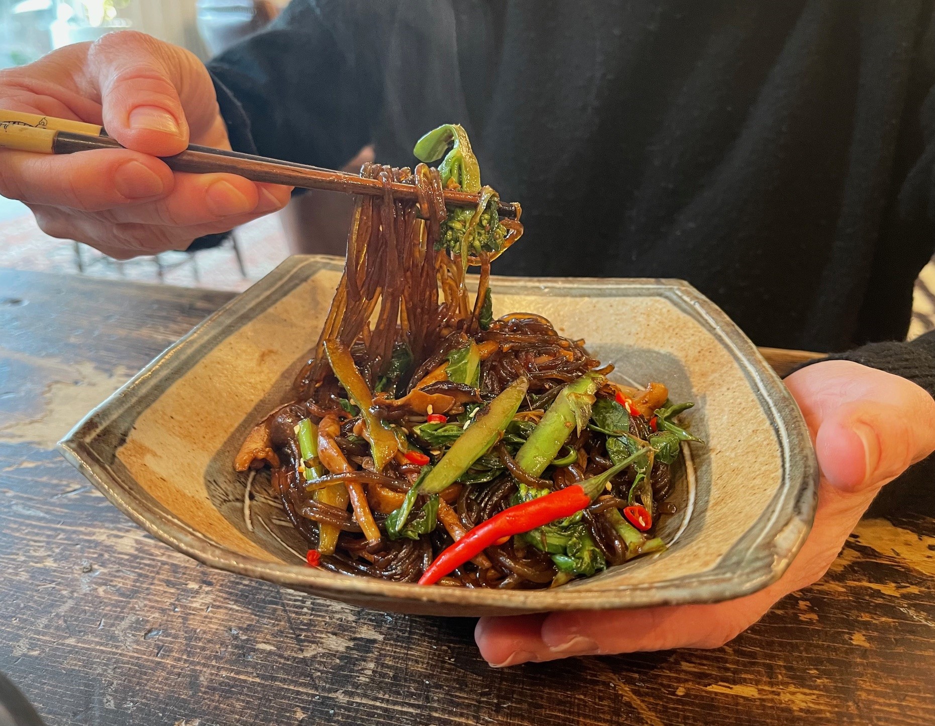 Finished dish with chopsticks