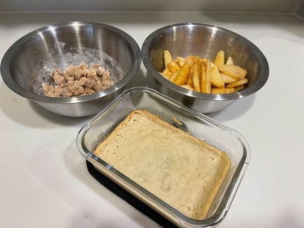crust baked and ingredients in bowl