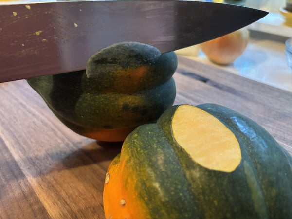 Cutting off a piece of squash