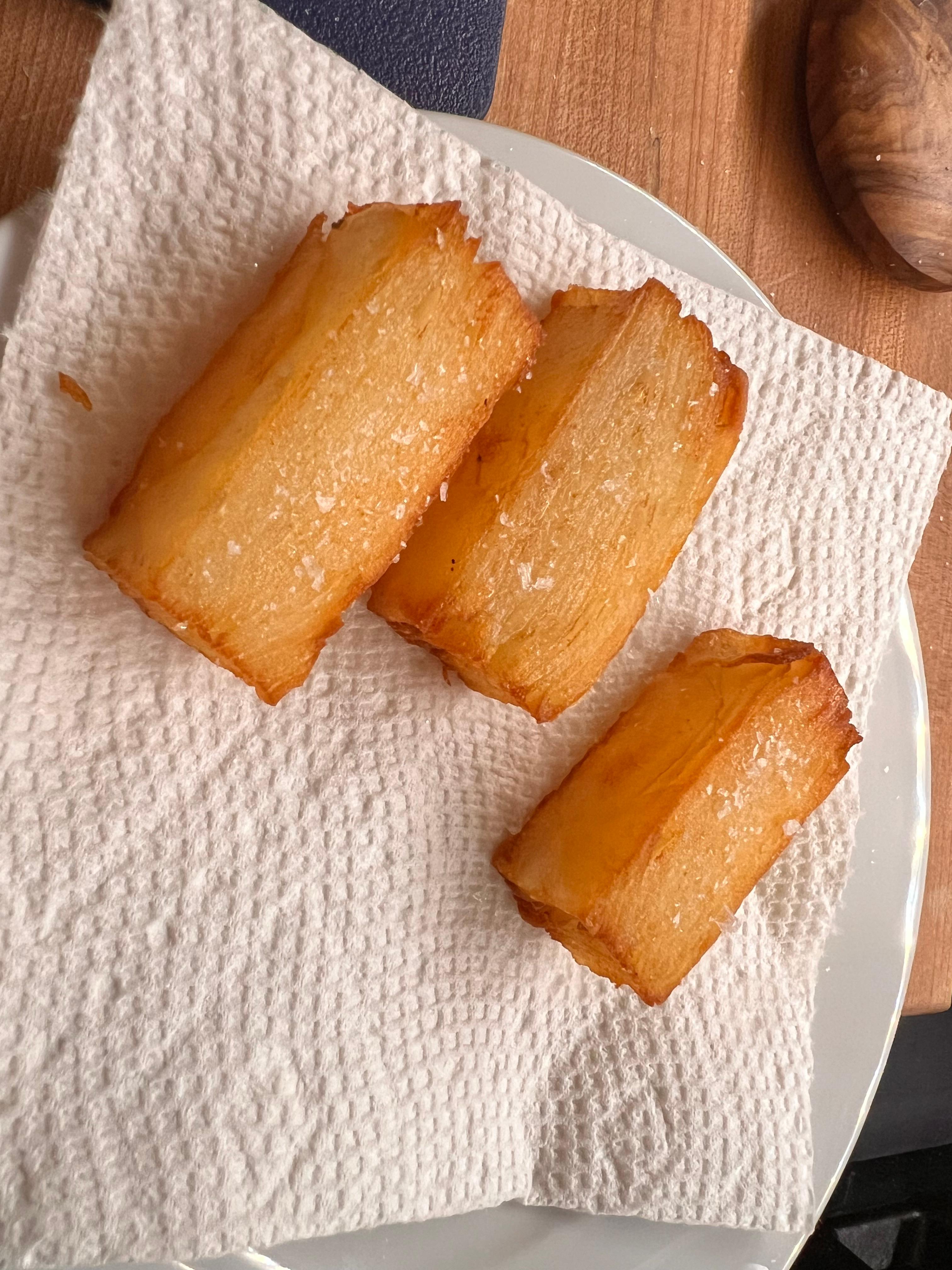 Cooked potatoes, draining on paper towel