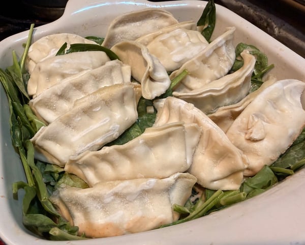 Dumplings on spinach