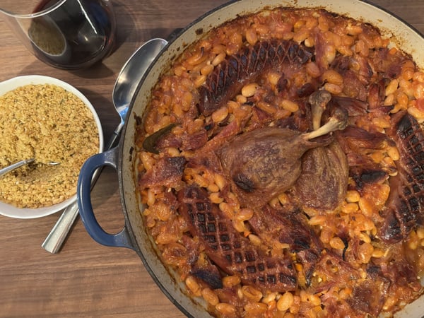Finished cassoulet with breadcrumbs on side