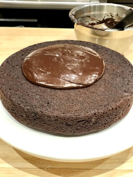 finished cocoa glaze poured on top of cake