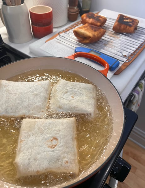 Frying first side of puffs