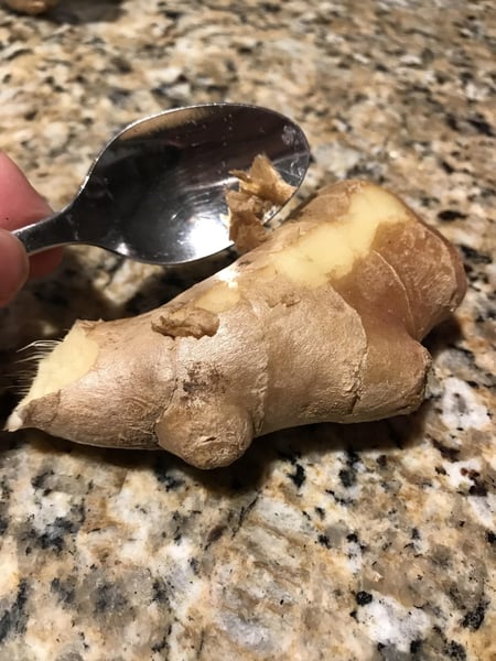 peel ginger with a spoon