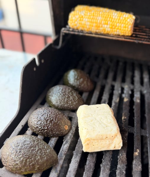 Grilling avocados corn and cheese