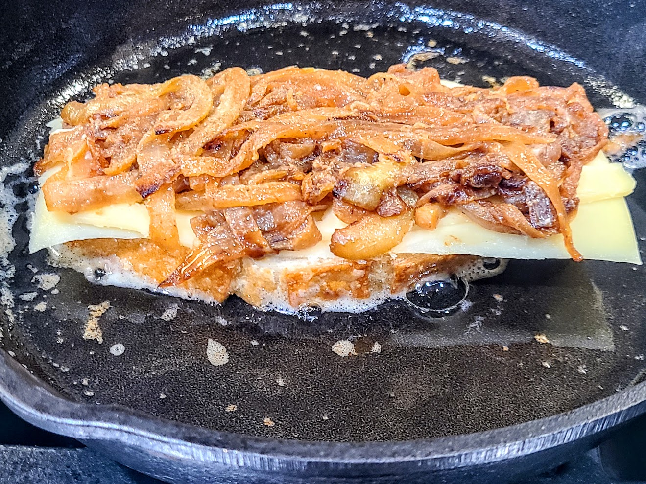 Half of grilled cheese sandwich