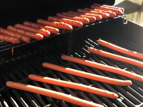 hot dogs on grill