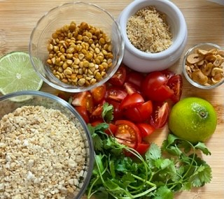 ingredients with tomatoes in center