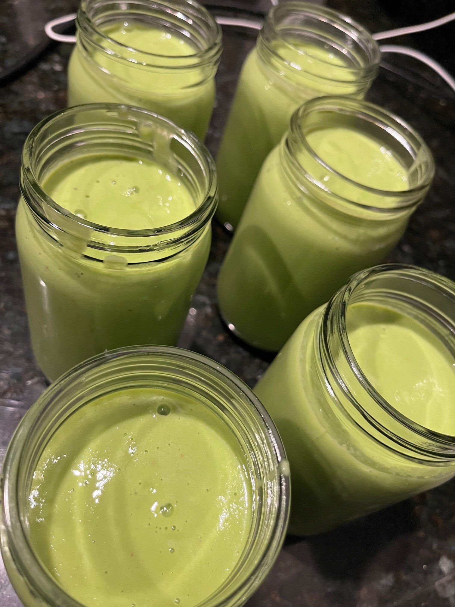 Jars of green smoothies