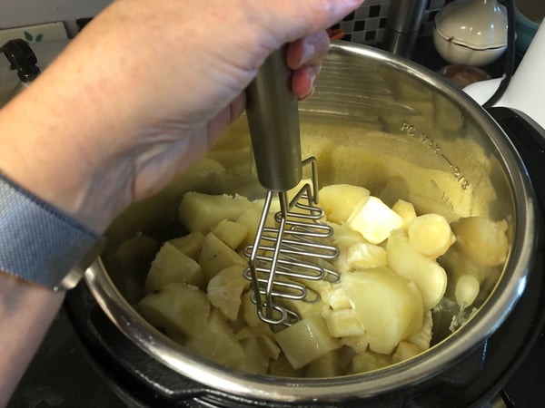 mashing potatoes and parsnips