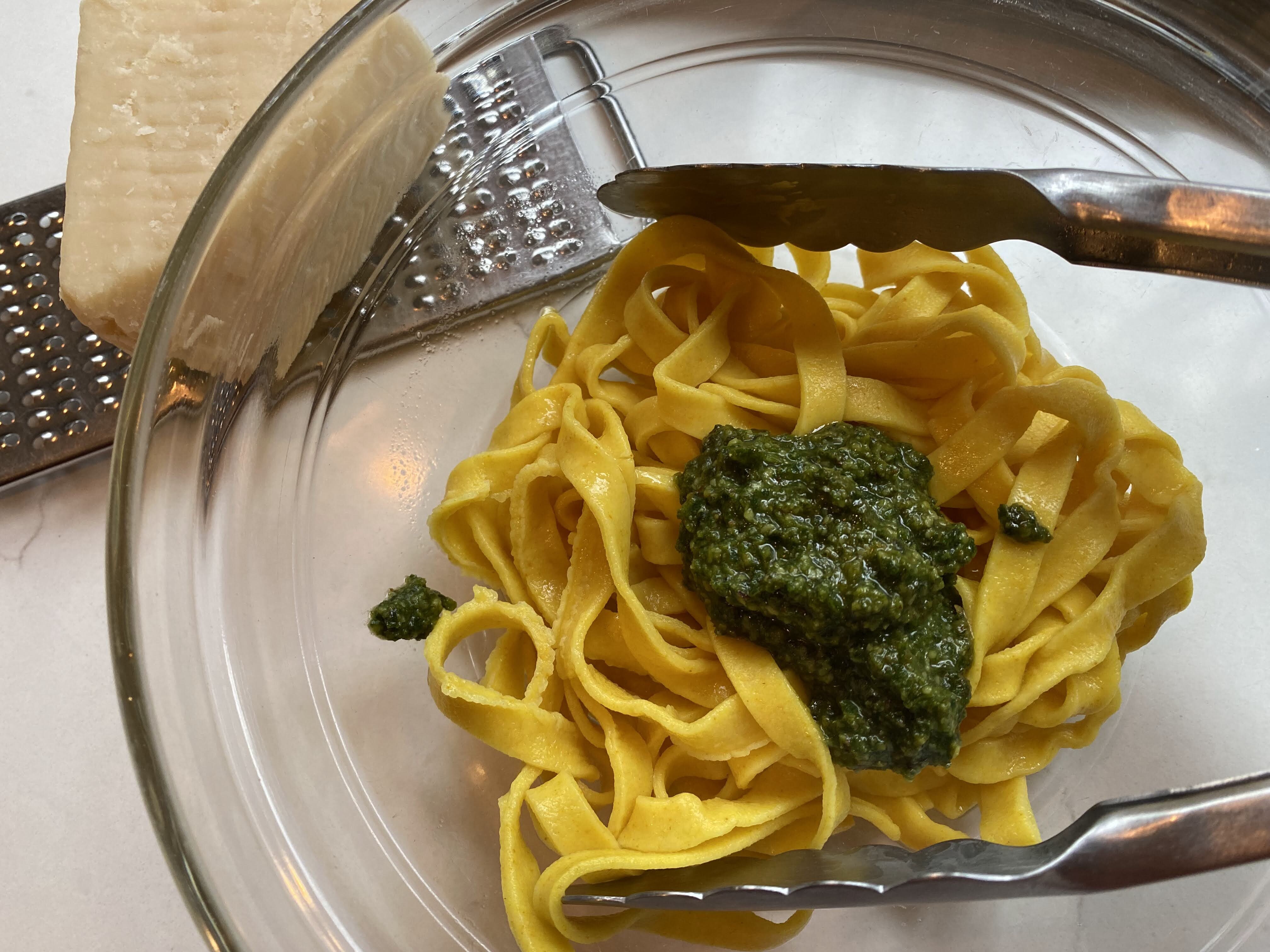Mixing pasta and pesto
