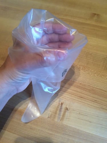 Things bakers know: A glass and a straight edge make piping bags mess-free