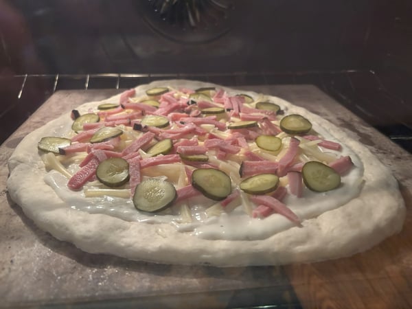 Pizza baking in oven