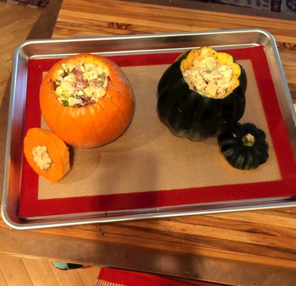 stuffed pumpkins on baking sheet