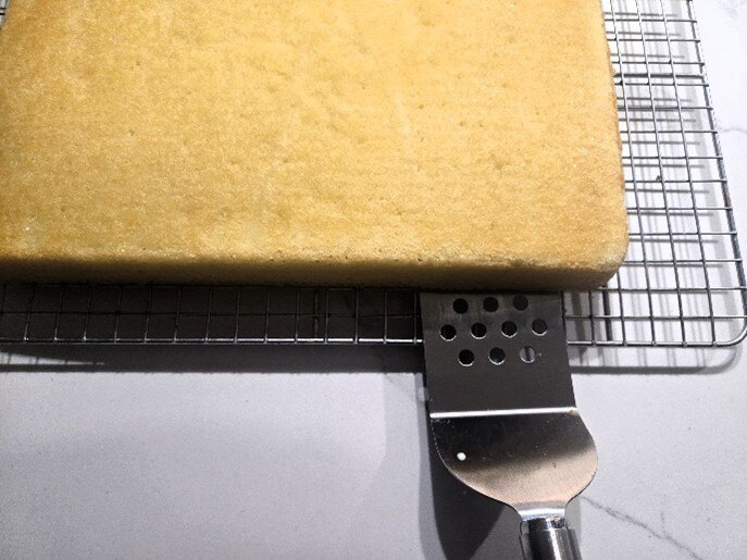 Remove cake from rack