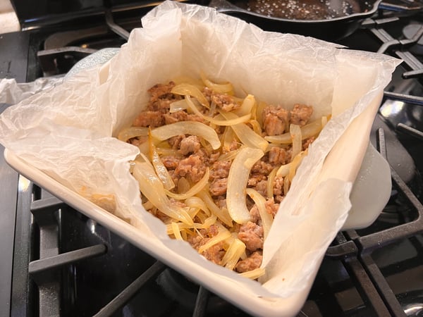 Sausage and onions in pan