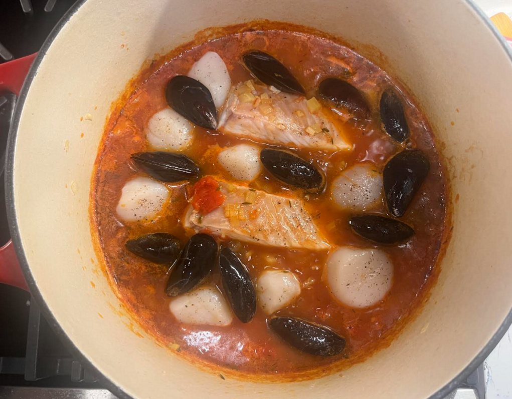 Scallops and fish added