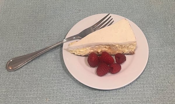 Cheesecake slice with raspberries