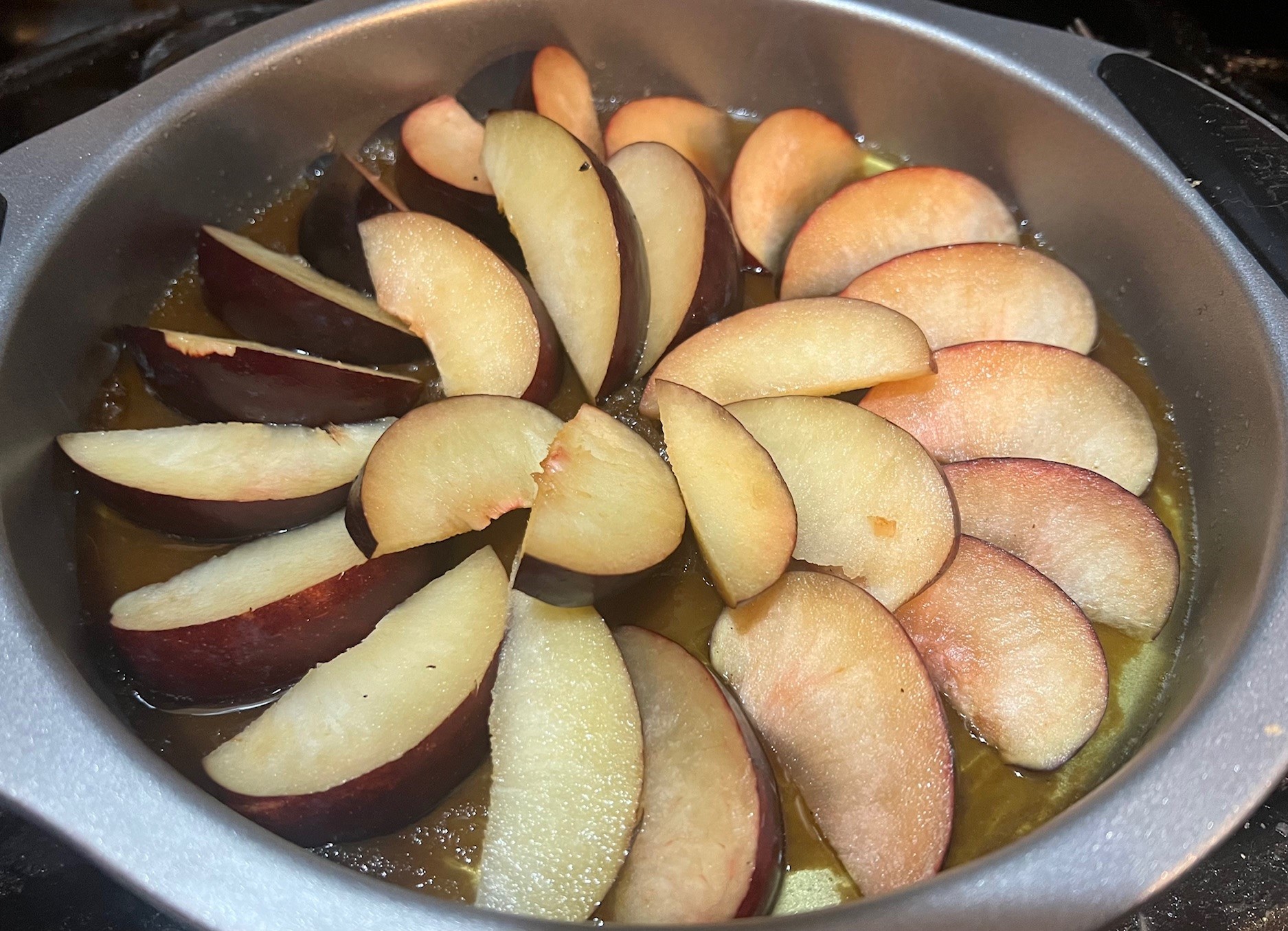 Sliced plums on topping