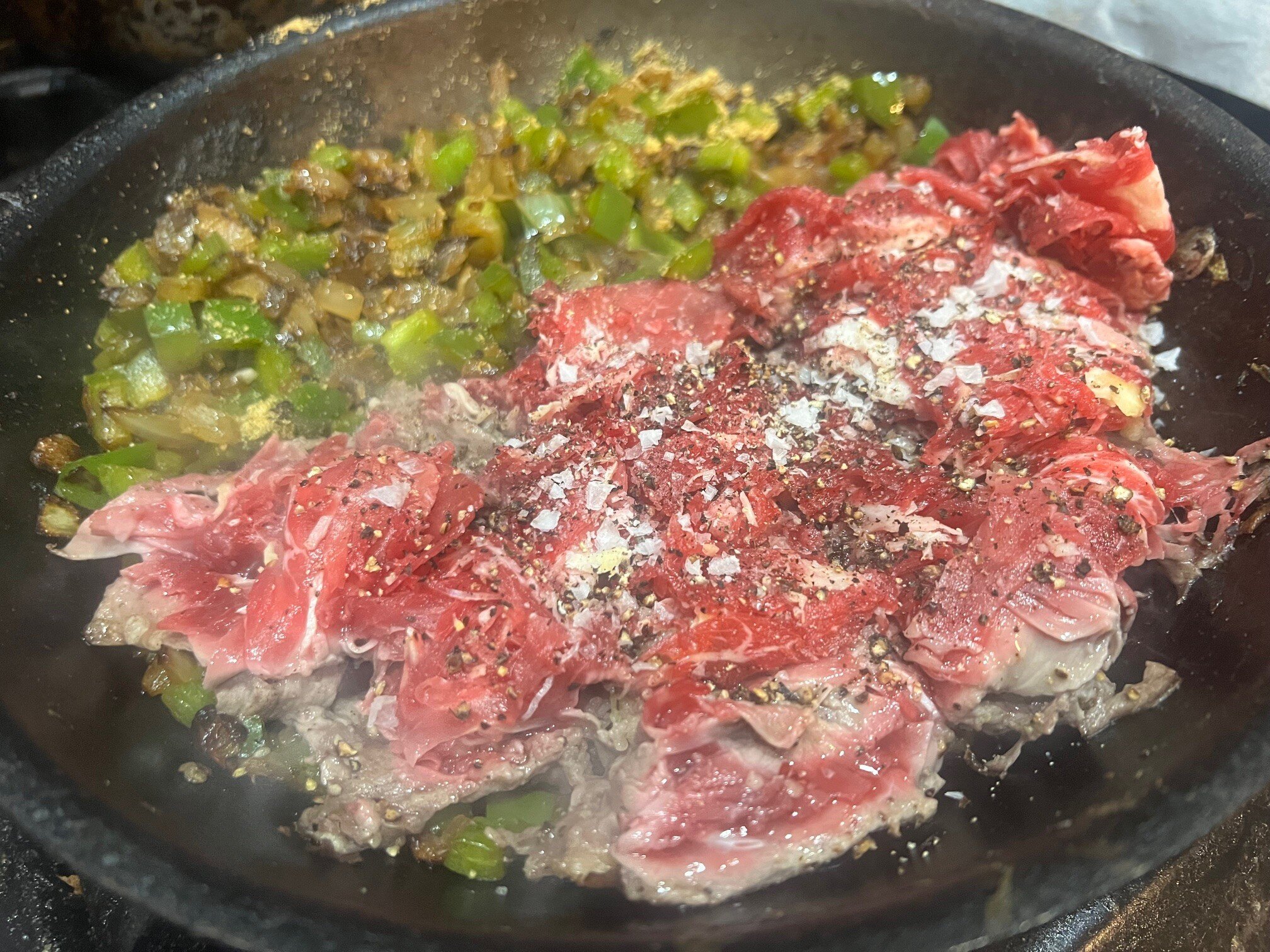 Steak with peppers and onions