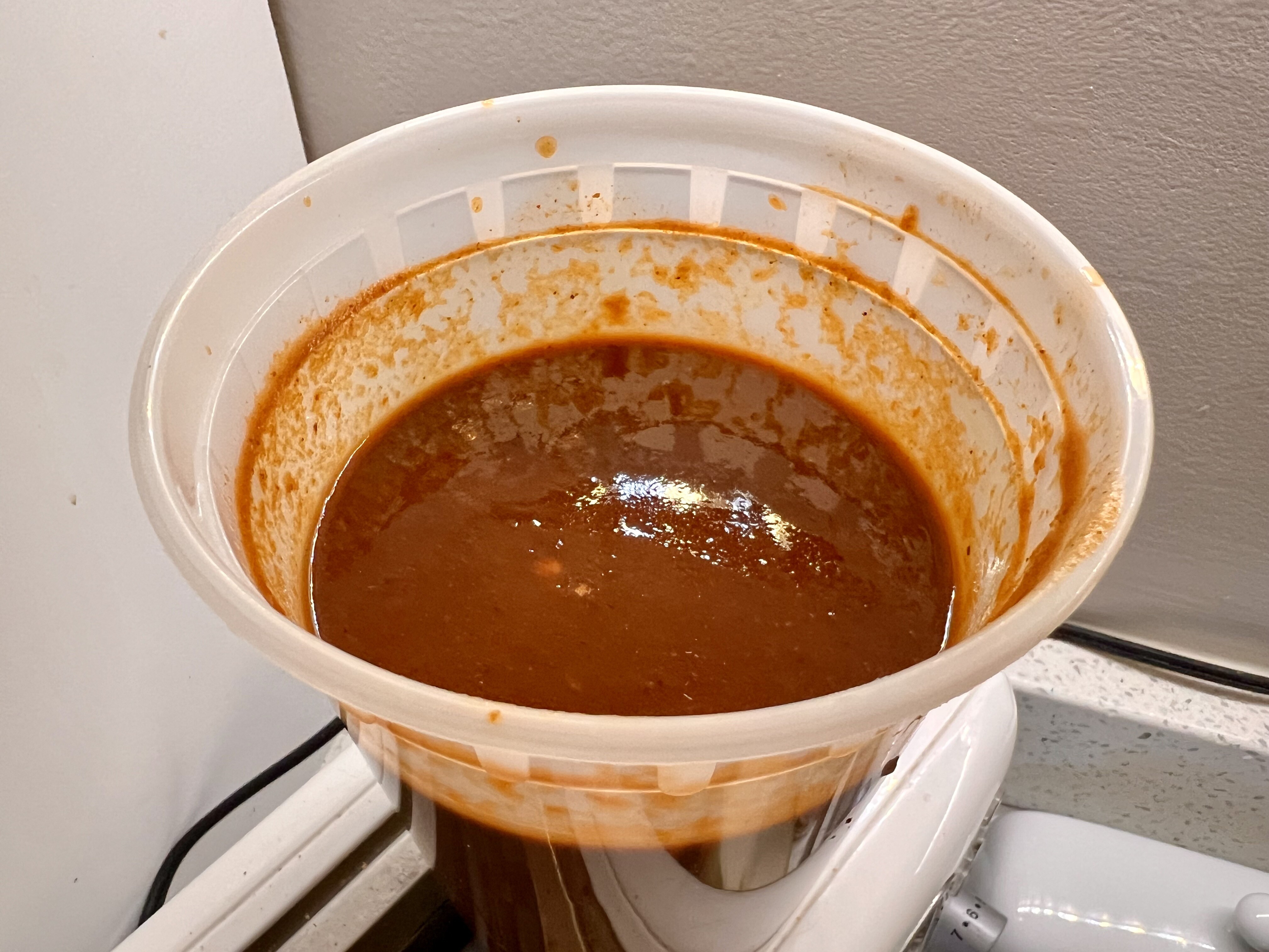 Straining chili puree