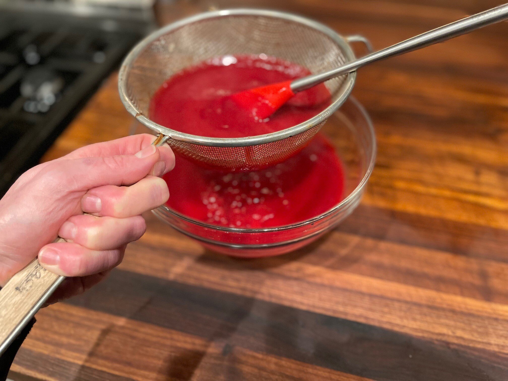 Straining cranberries