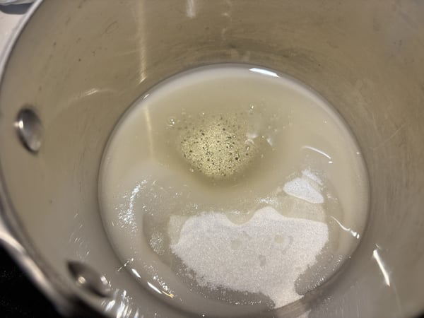Sugar and water in pan