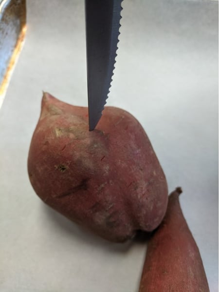 sweet potato with knife
