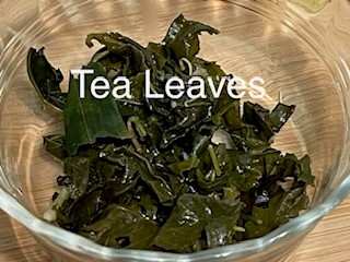tea leaves in glass bowl