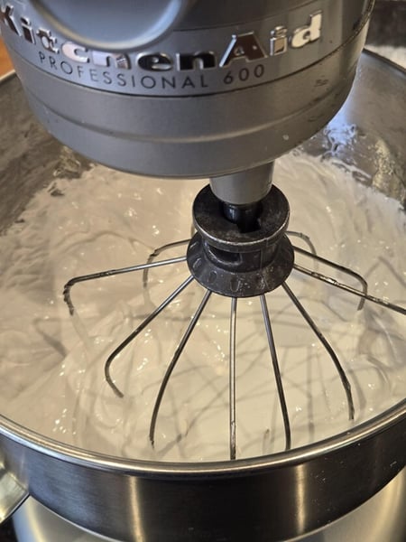 Whisking marshmallow mixture