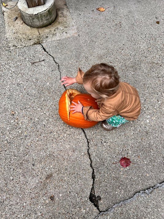 Willa smashing pumpkin