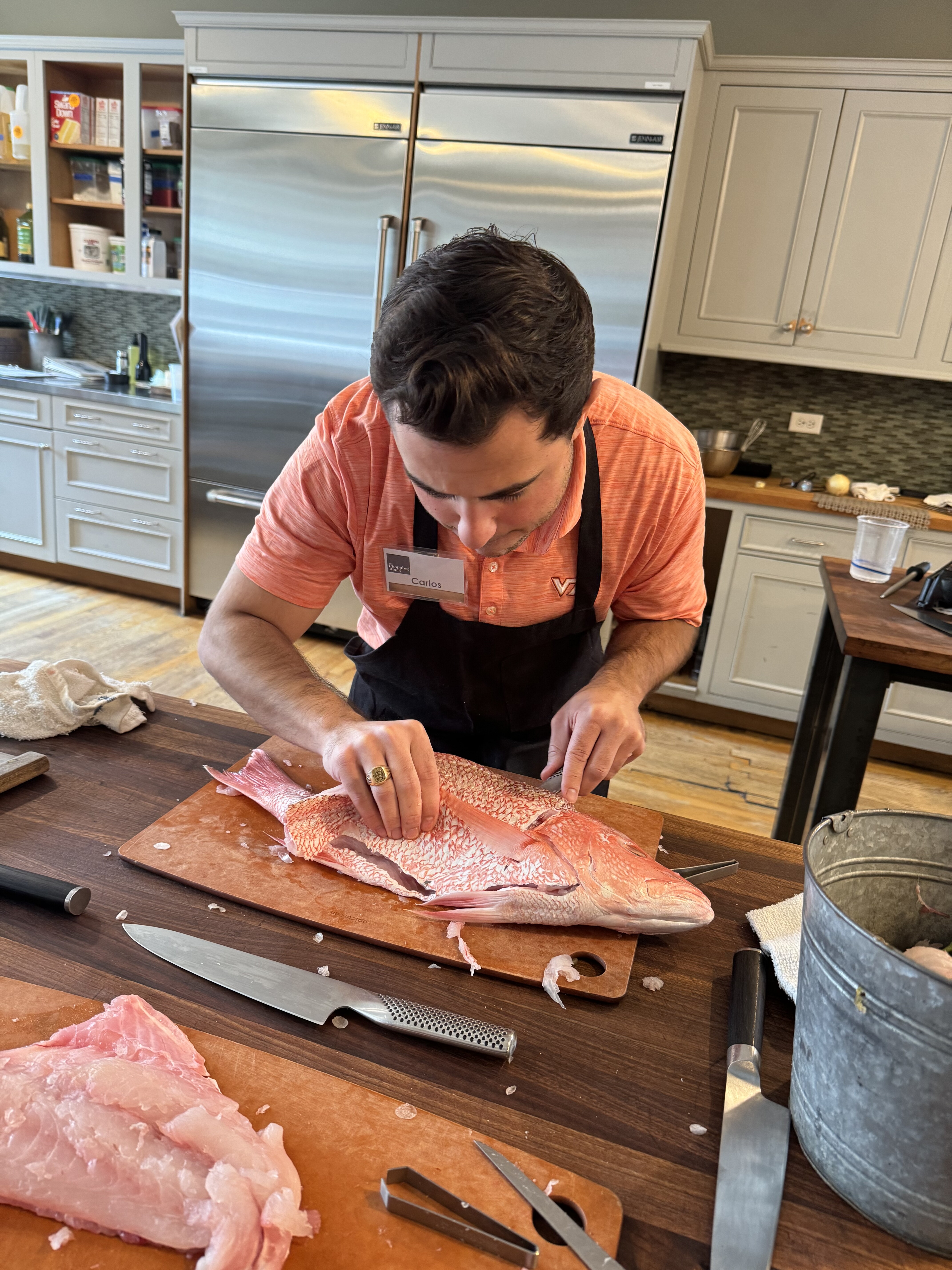 Carlos butchering fish